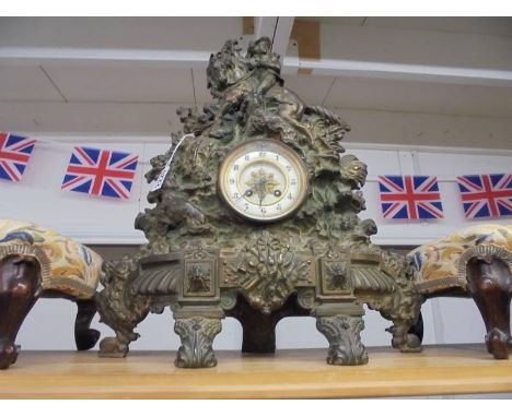 A Victorian cast iron 8 day clock with bronzed finish featuring horse, rider and gun dogs, 48cm wide x 60.5 cm high. COLLECT 