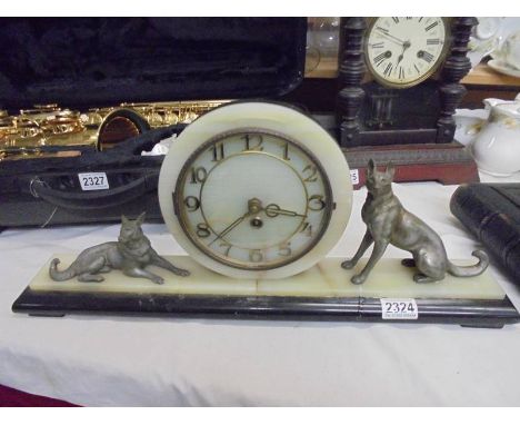 A French art deco mantel clock surmounted dogs, COLLECT ONLY.