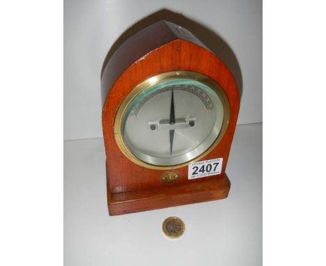 A brass bound differential galvanometer by A.C.M of Liverpool, mounted in a solid wooden steeple case circa 1930.