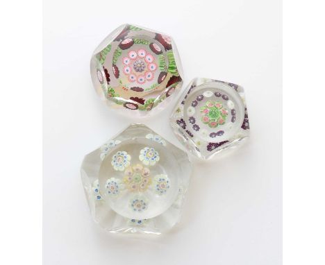 A Clichy glass faceted paperweight,19th century, with concentric millefiori decoration incorporating Clichy roses,4.4cm diame