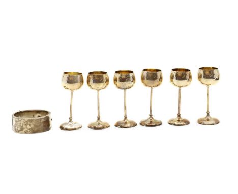 A collection of silver items,comprising a bangle, Birmingham 1901, 5.5cm diameter, a cased set of six liquor cups, by Stuart 