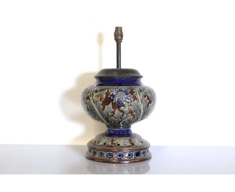 A Doulton Lambeth stoneware mounted lamp base, with tubelining and pierced details, impressed marks and incised artists' mono