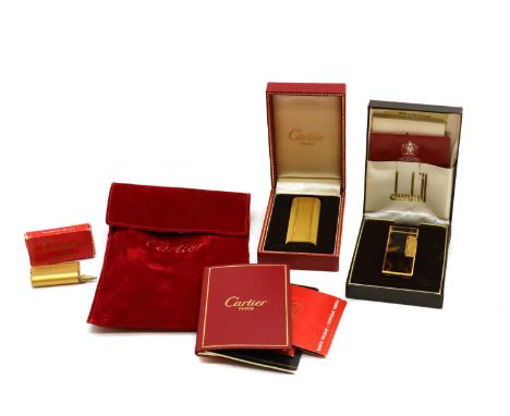 A Dunhill gold-plated 'Rollagas' lighter,with tortoiseshell lacquered body, complete with box and papers, 6.4cm high,together