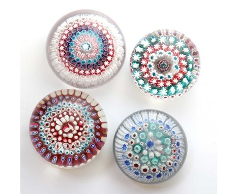 A group of four Old English glass paperweights,19th century, possibly by George Bacchus &amp; Sons, the first with a high dom