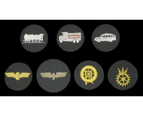 German Second World War Reichbahn Insignia. 7 Specialist patches. Carriage service, yellow embroidery, winged wheel on dark b