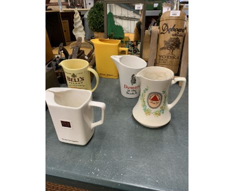 A COLLECTION OF FIVE WATER JUGS TO INCLUDE FOUR WADE AND ONE BURLEIGH WARE