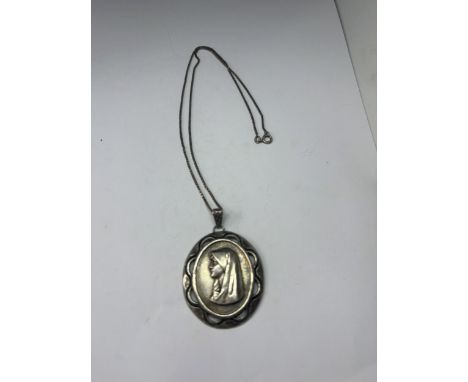A SILVER NECKLACE WITH A MADONNA PENDANT