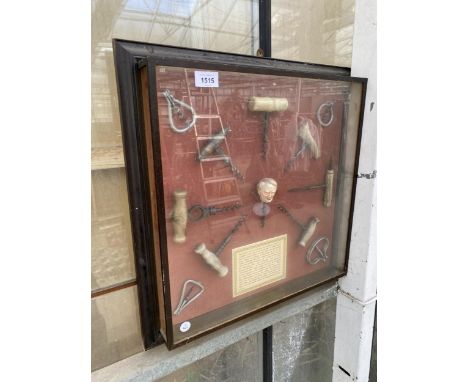 A VINTAGE FRAMED HISTORY OF THE CORKSCREW WITH 12 VARIOUS COORKSCREWS AND A DESCRIPTION CARD