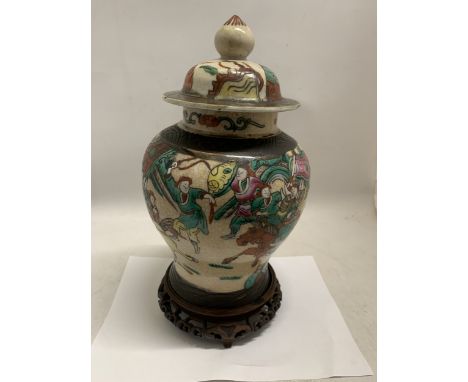 A CHINESE NANKING PORCELAIN CRACKLE GLAZE GINGER JAR LATE 19TH CENTURY DECORATED IN ENAMELS WITH FIGURES AND HORSES WITH FOUR