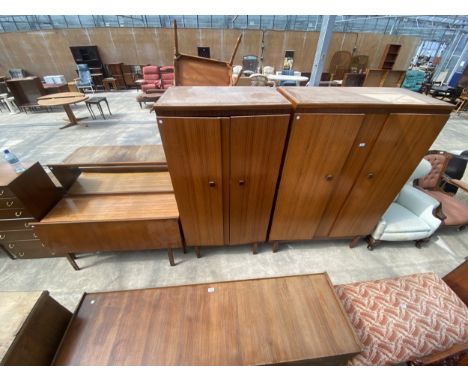 A RETRO TEAK REMPLOY FOUR PIECE BEDROOM SUITE COMPRISING: TWO WARDROBES, 48" X 35" WIDE, INVERTED BOW FRONTED DRESSING TABLE,