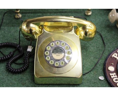 A VINTAGE GOLD COLOURED ROTARY DIAL TELEPHONE