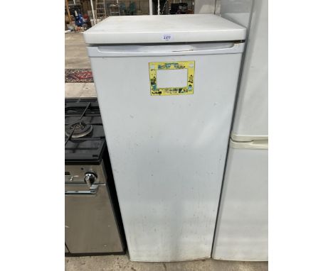 A WHITE UPRIGHT FRIDGE