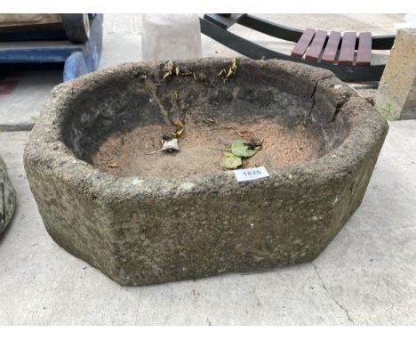 AN OCTAGONAL RECONSTITUTED STONE TROUGH PLANTER