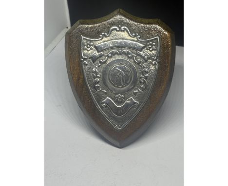 A HALLMARKED BIRMINGHAM SILVER CRICKET RELATED SHIELD IN A WOODEN BASE