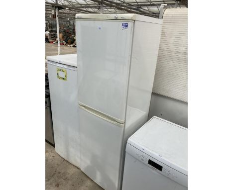 A TALL WHITE BEKO UPRIGHT FRIDGE FREEZER
