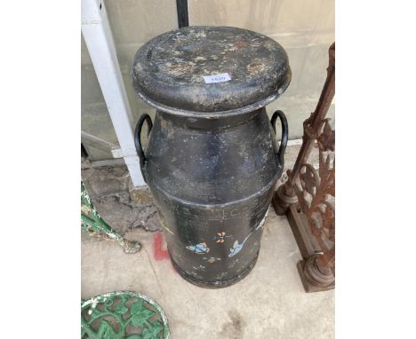 A VINTAGE BLACK PAINTED CWS CAST IRON MILK CHURN WITH LID AND PAINTED DETAIL