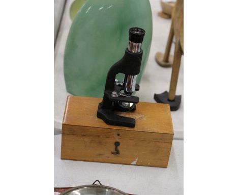 A VINTAGE MICROSCOPE IN WOODEN BOX