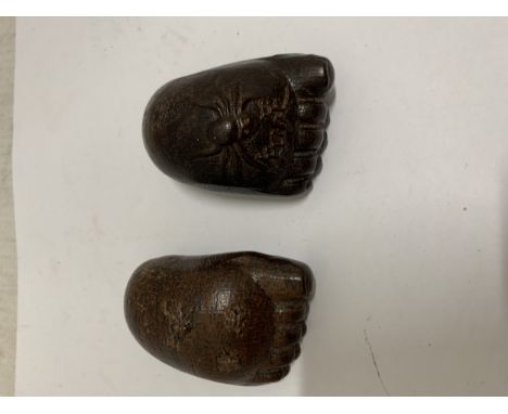 A PAIR OF CHINESE HAND CARVED NETSUKE FEET WITH SPIDER DETAIL