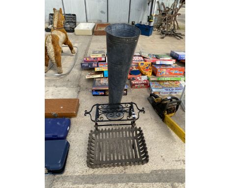 A CAST IRON FIRE GRATE, A TRIVET STAND AND A LARGE METAL VASE