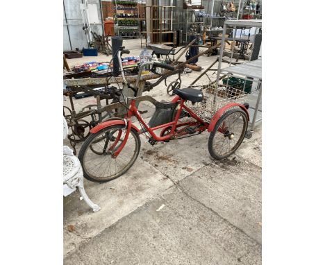 A GOMIER TRICYCLE WITH REAR BASKET