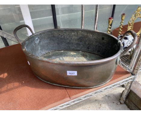 A LARGE VINTAGE OVAL COPPER TROUGH WITH STEEL HANDLES