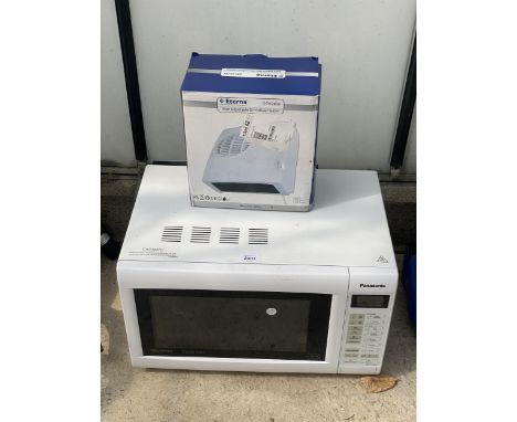 A WHITE PANASONIC MICROWAVE OVEN AND A SMALL HEATER