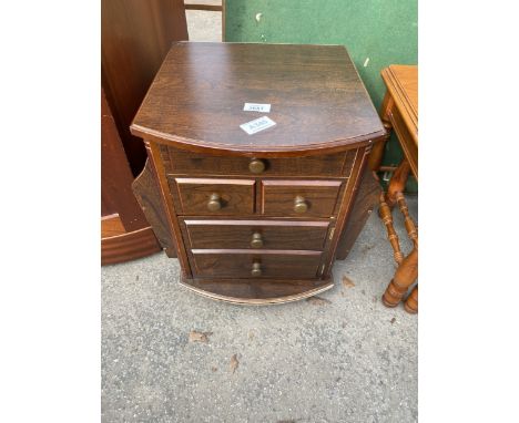 A FOLDING CARD TABLE AND MINIATURE CHEST OF DRAWERS WITH MAGAZINE HOLDERS