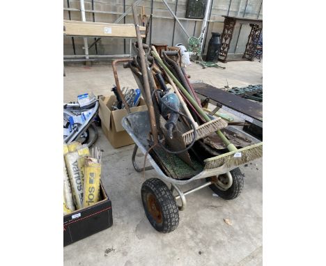 A METAL TWO WHEELED WHEEL BARROW WITH AN ASSORTMENT OF TOOLS TO INCLUDE A MAKITA 110V GRINDER, SHOVELS AND A PITCH FORK ETC