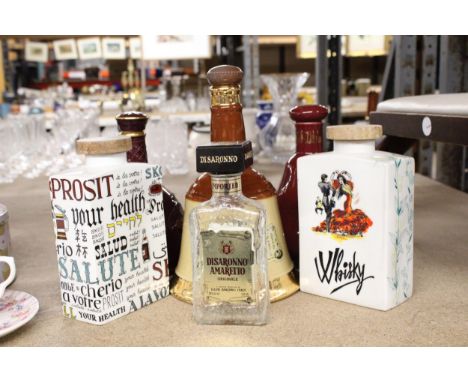 A QUANTITY OF EMPTY DECANTERS TO INCLUDE BELLS SCOTCH WHISKY, ETC.,