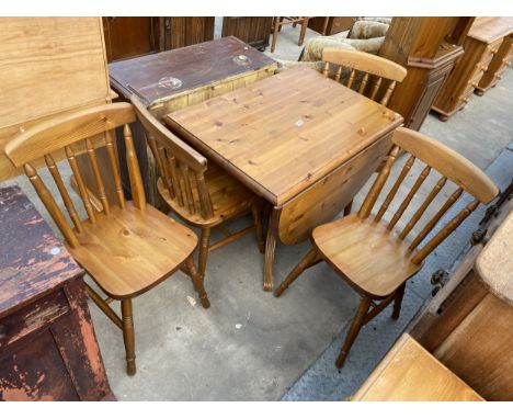 A PINE DUCAL DROP LEAF PEDESTAL DINING TABLE AND FOUR CHAIRS, 58.5" X 36" OPENED