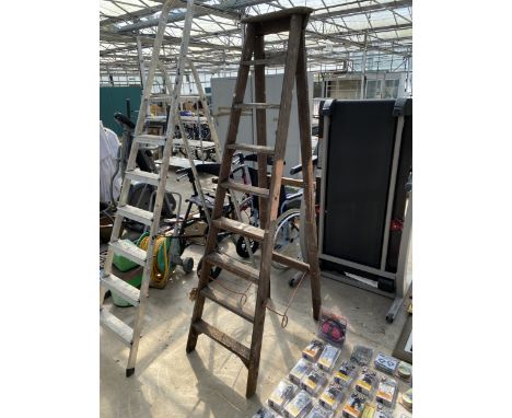 A VINTAGE EIGHT RUNG WOODEN STEP LADDER
