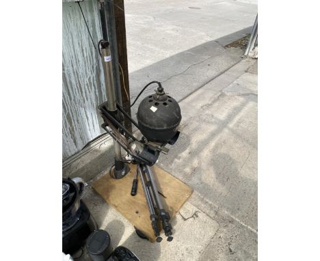 A LEITZ FOCOMAT ENLARGER AND A CAMERA TRIPOD