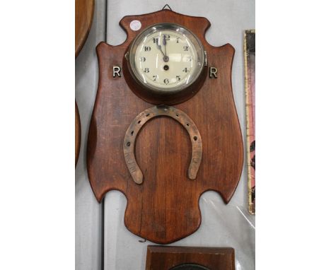 A RED RUM HORSESHOE WALL CLOCK