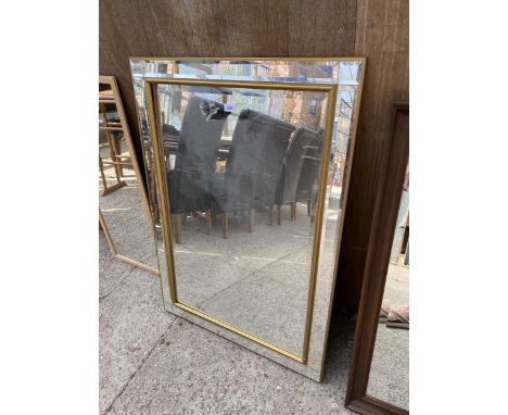 A BEVEL EDGE WALL MIRROR WITH BEVEL EDGE OUTER FRAME, 42" X 29"