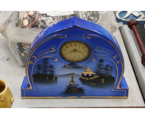 AN ART DECO MOONLIGHT WARE BLUE ORIENTAL CLOCK