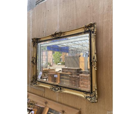A GILT FRAMED BEVEL EDGE WALL MIRROR, 32" X 23"