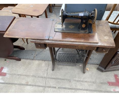 A SINGER TREADLE SEWING MACHINE, NO. Y8146885