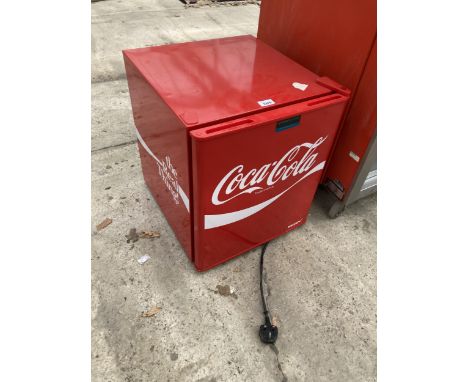 A SMALL COCA COLA COUNTER TOP FRIDGE