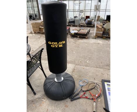 A GOLDS GYM PUNCH BAG, THREE TENNIS RACKETS AND A BADMINTON RACKET