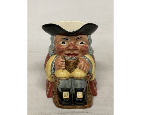 A CLARICE CLIFF TOBY JUG MODELLED AS A SEATED GENT WITH FOAMING MUG PAINTED IN UNDERGLAZE COLOURS