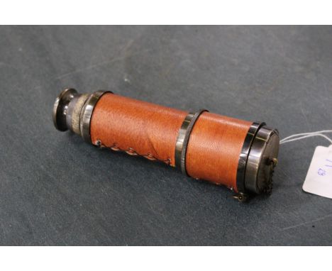 A BRASS AND LEATHER TELESCOPE