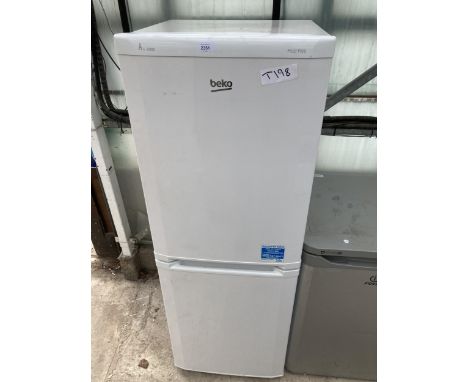 A WHITE BEKO UPRIGHT FRIDGE FREEZER