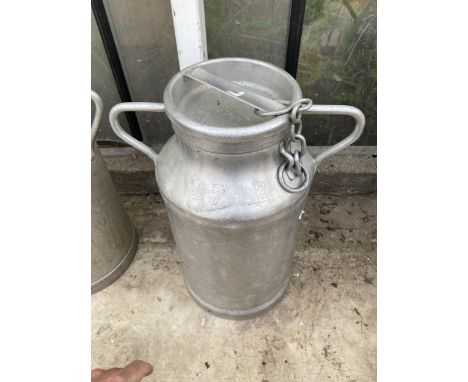 A CAST ALLOY MILK CHURN WITH CHAINED LID AND TWO CARRYING HANDLES (H:49CM)
