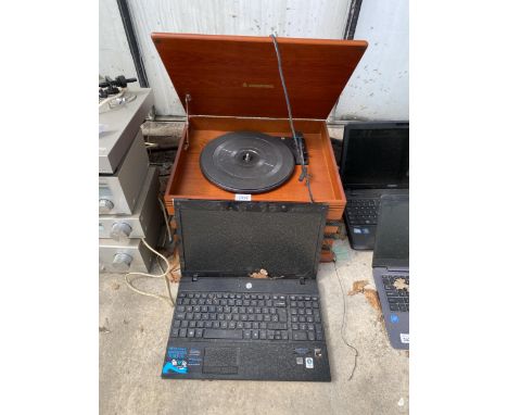 A RETRO STYLE RECORD PLAYER AND A LAPTOP