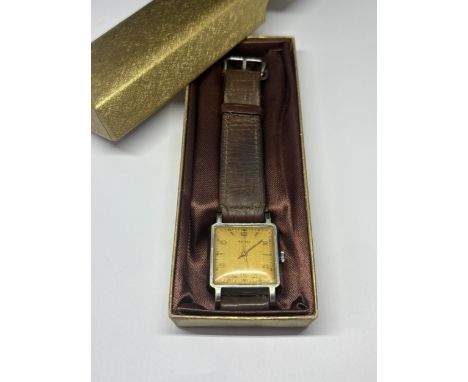 A 1940'S RENEL GENTS WRIST WATCH WITH ORIGINAL LEATHER STRAP SEEN WORKING BUT NO WARRANTY