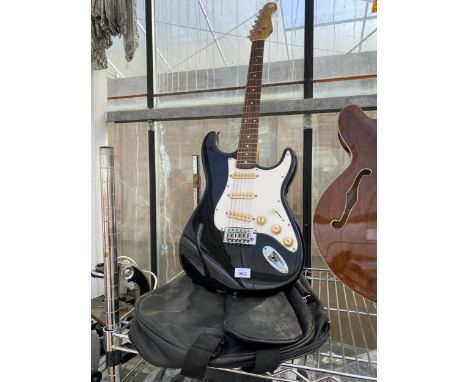 AN ELECTRIC GUITAR WITH CARRY CASE