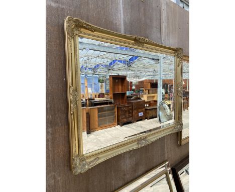 A GILT FRAMED WALL MIRROR WITH BEVEL EDGE, 41" X 29"