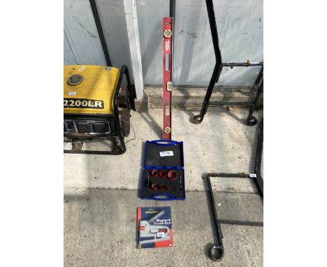 A HOLE SAW CUTTING SET, A SPIRIT LEVEL AND A STAPLE GUN