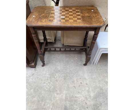 A VICTORIAN OAK DRAUGHTS/CHESS TABLE WITH CANTED CORNERS ON TURNED LEGS, 30" X 17.5"