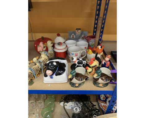 A MIXED LOT TO INCLUDE A CAST DOORSTOP, EGGCUPS, COW BUTTER DISH, MUGS, ETC.,